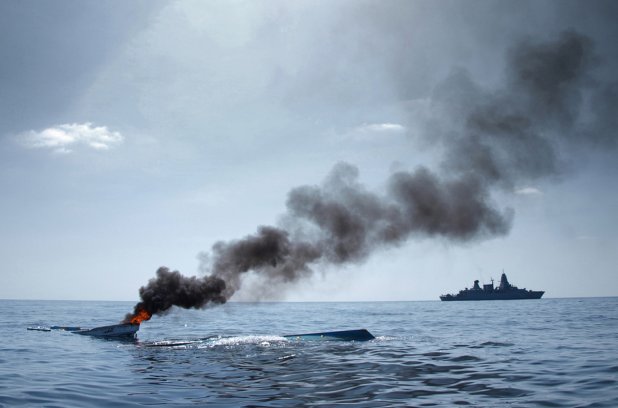German frigate Hamburg sinks an abandoned skiff off the coast of Somalia. Credit: Christian Bundeswehr - Reuters